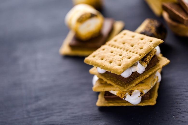 Freshly toasted smores with large white marshmallows.