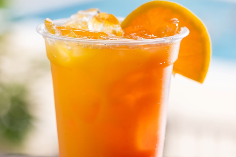 Tequlia Sunrise cocktail with an orange slice garnish